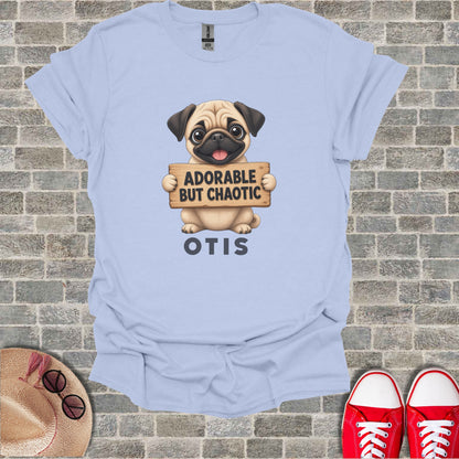 Light blue t-shirt with pug holding "Adorable But Chaotic Otis" sign.