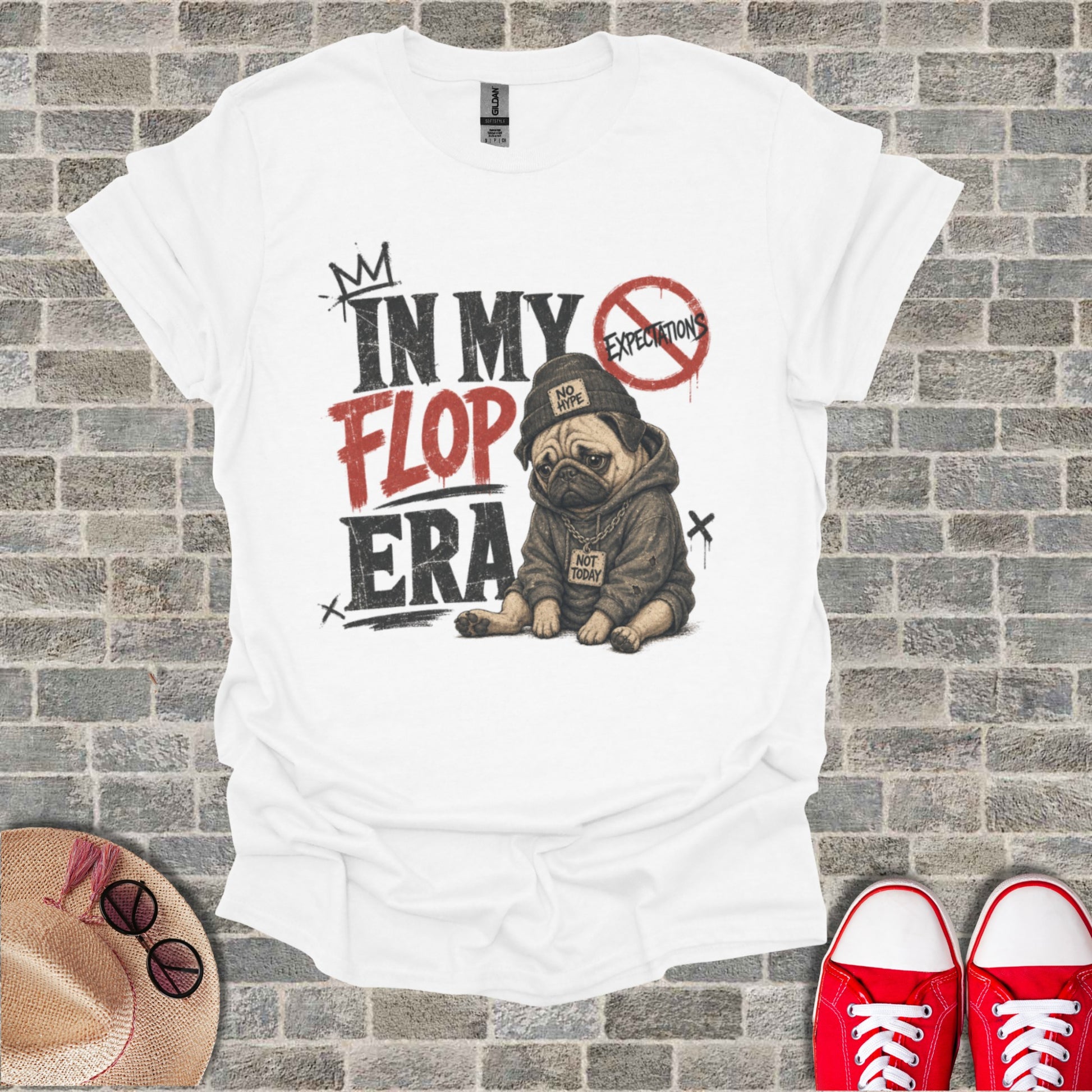 White t-shirt with "In My Flop Era" text and a pug wearing a hoodie.
