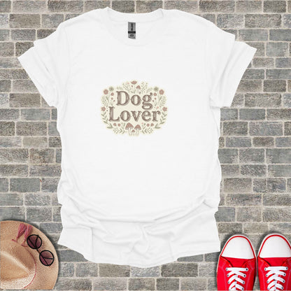 White t-shirt with "Dog Lover" floral and mushroom graphic.
