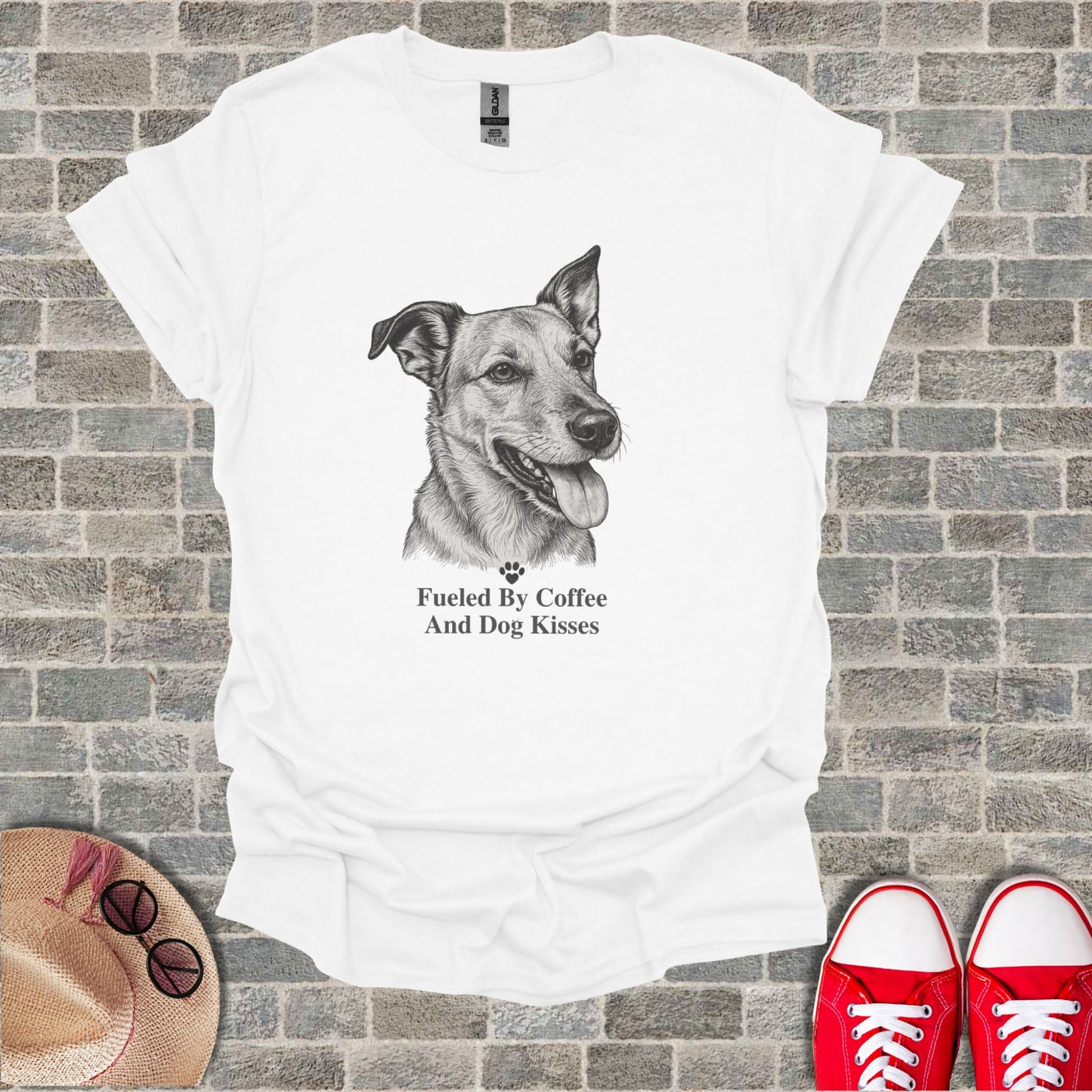 White t-shirt with sketch of dog and text "Fueled By Coffee And Dog Kisses".