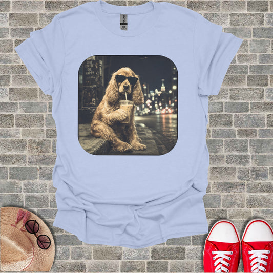 Light blue t-shirt with a graphic of a dog drinking coffee at night.