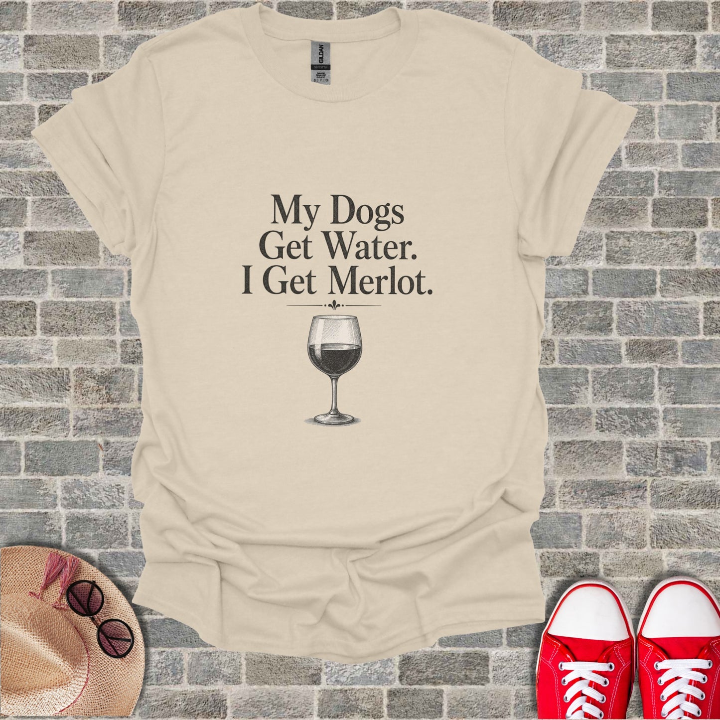 T-shirt with "My Dogs Get Water. I Get Merlot." text and wine glass graphic.