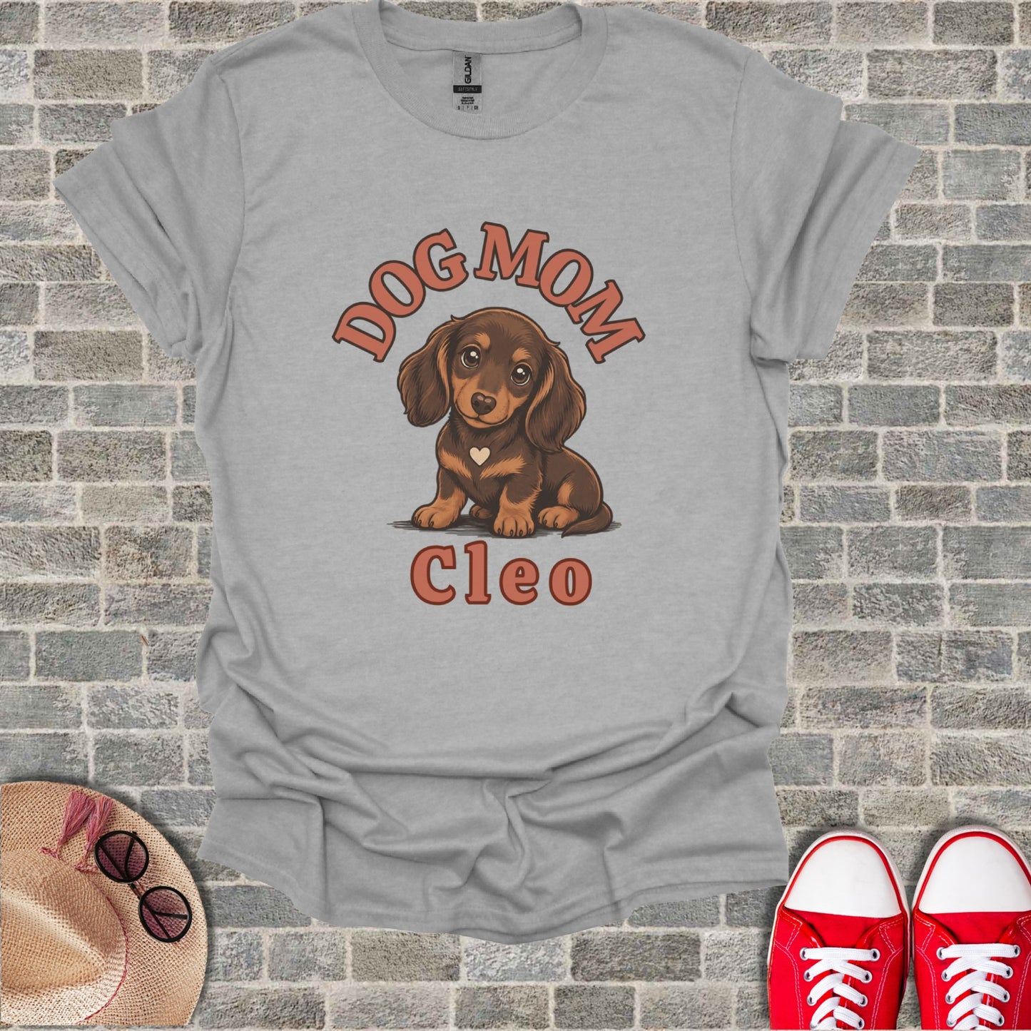 T-shirt with "Dog Mom Cleo" text and dachshund illustration