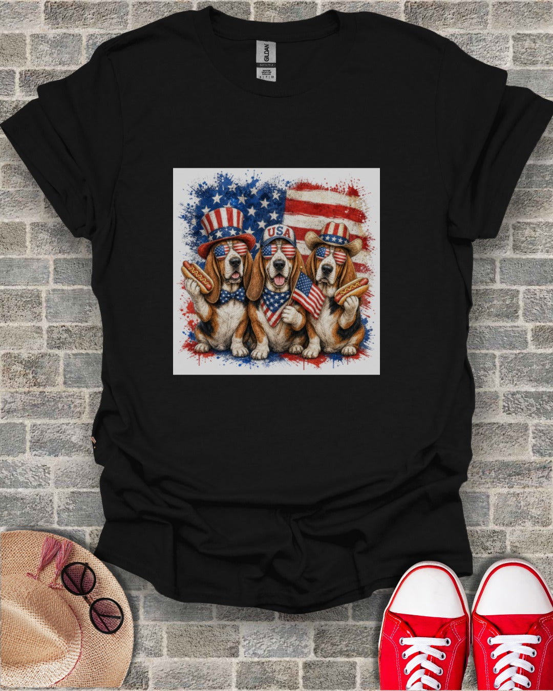 Three beagles in patriotic hats holding hot dogs.