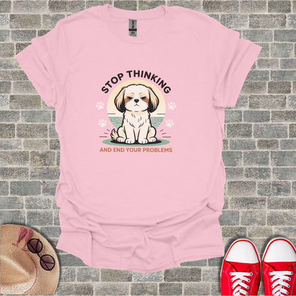 Pink t-shirt with a grumpy dog graphic and text "Stop thinking and end your problems."