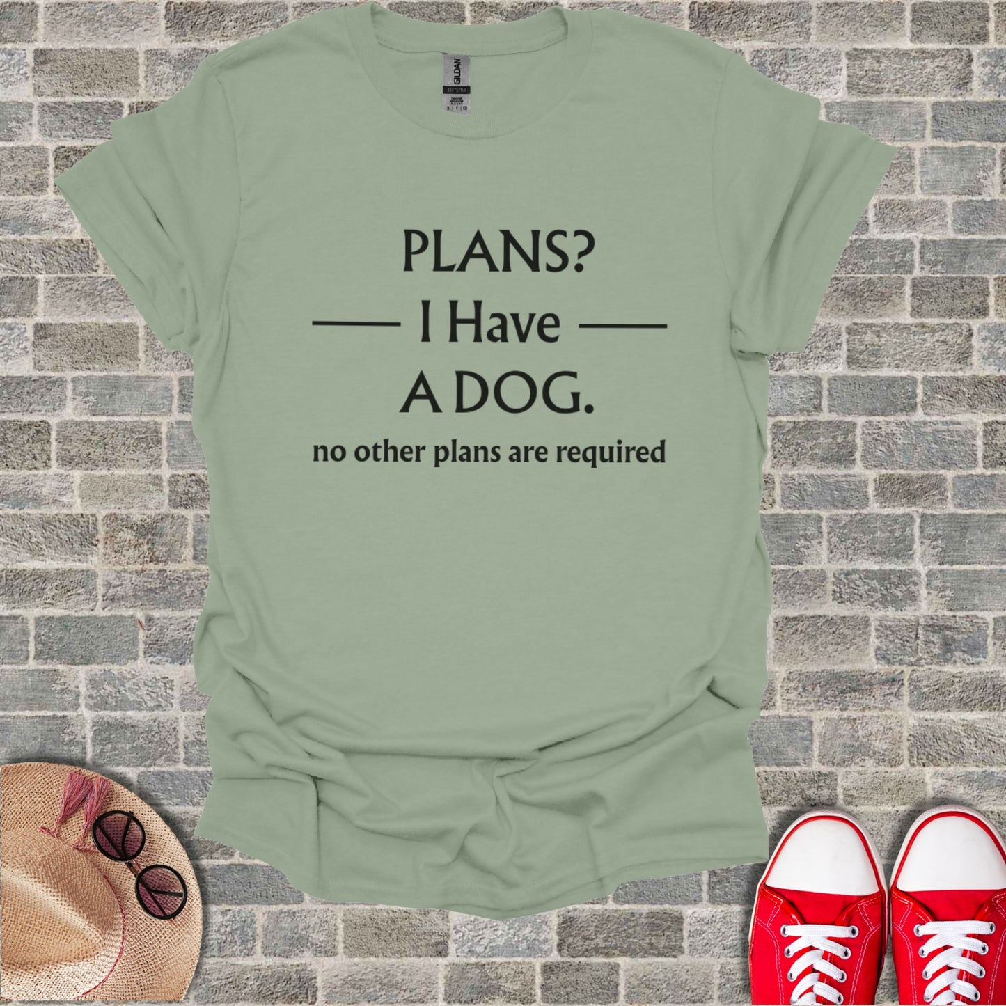 Light green t-shirt with black text: PLANS? I Have A DOG. no other plans are required.