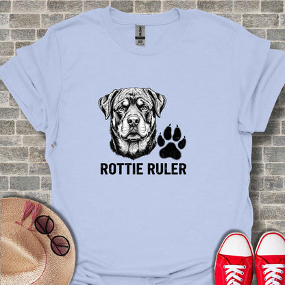 Light blue t-shirt with a Rottweiler head and paw print graphic.