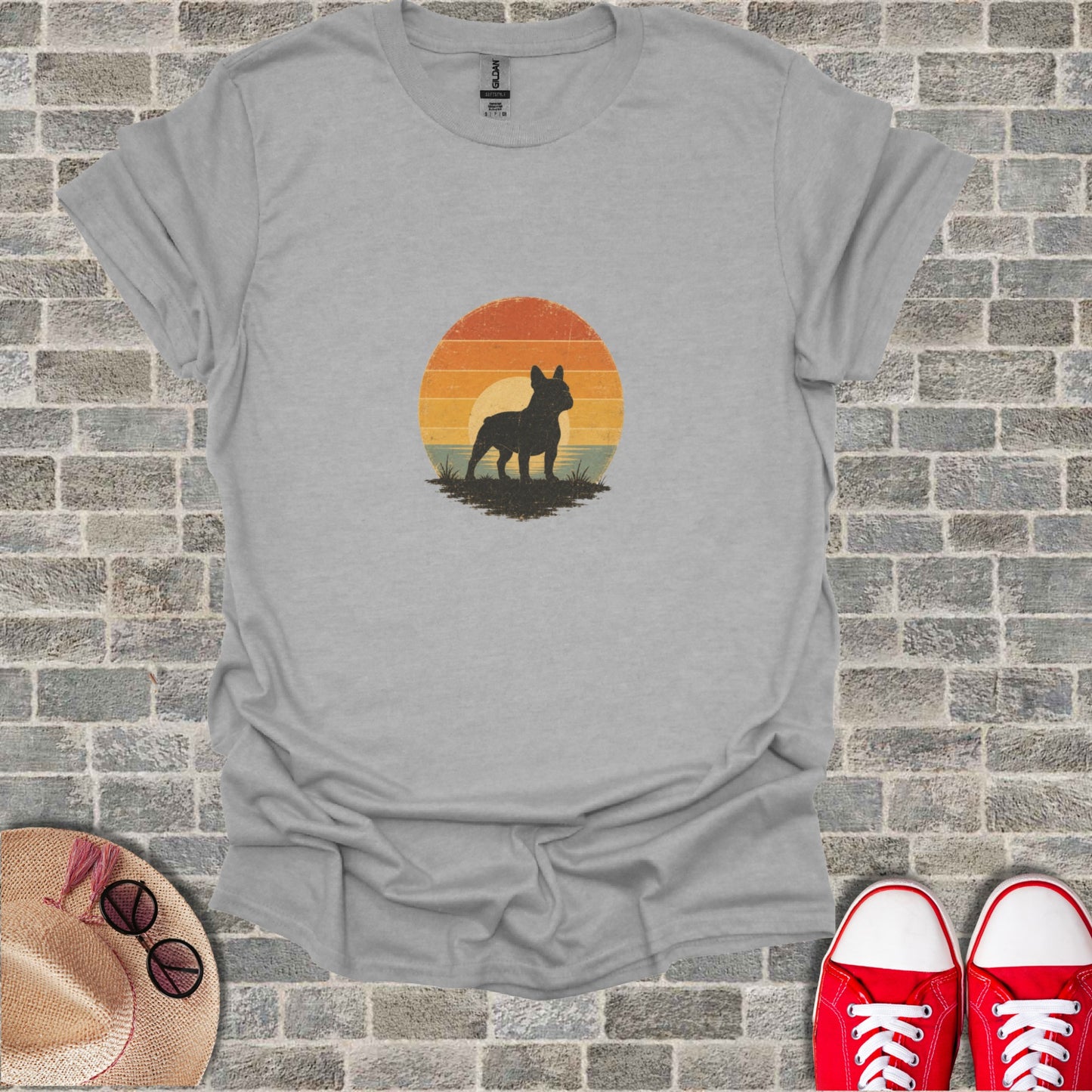 French Bulldog silhouette against a vintage sunset graphic on a grey t-shirt.