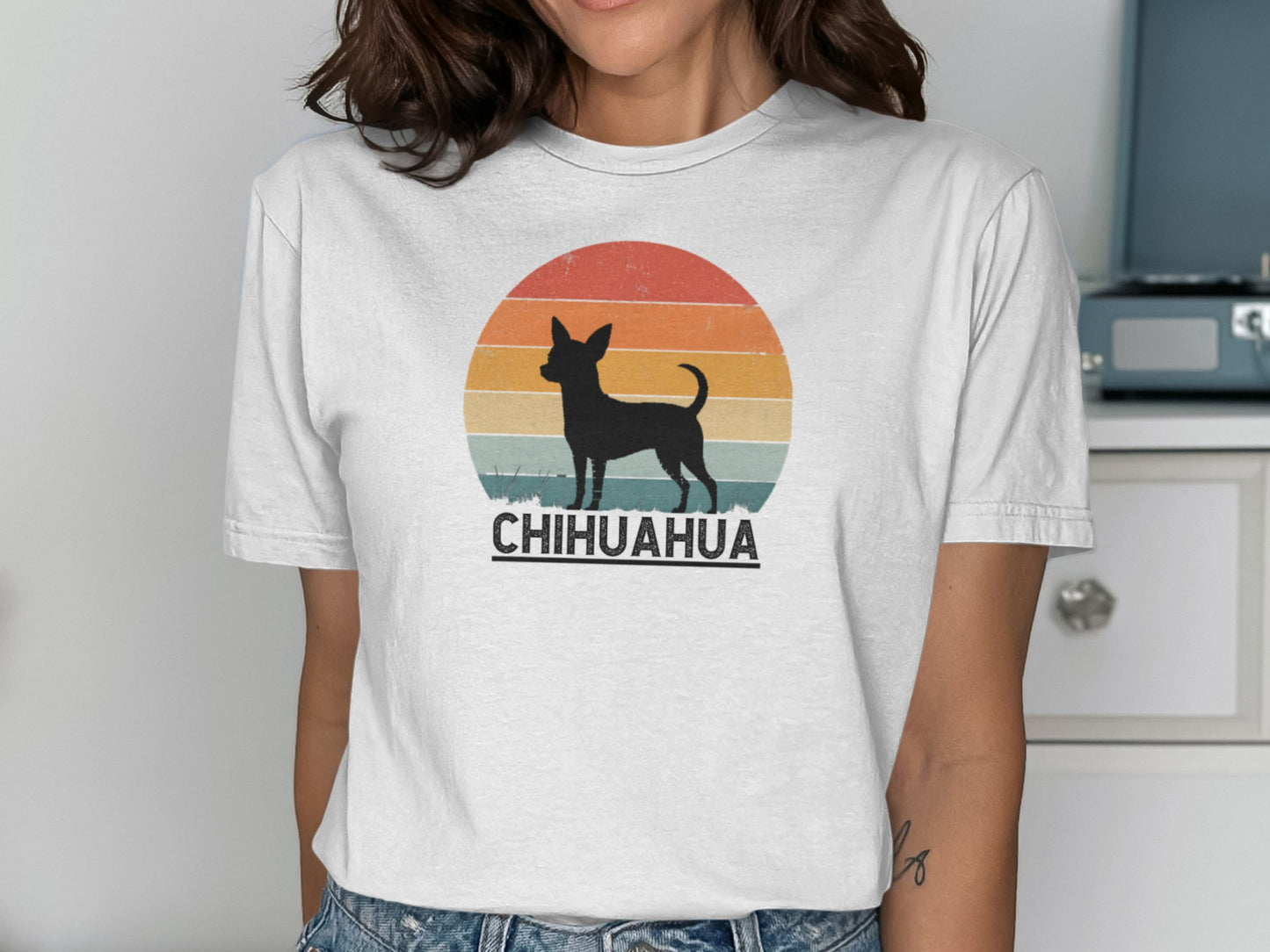 Chihuahua silhouette against a retro sunset on a white t-shirt.