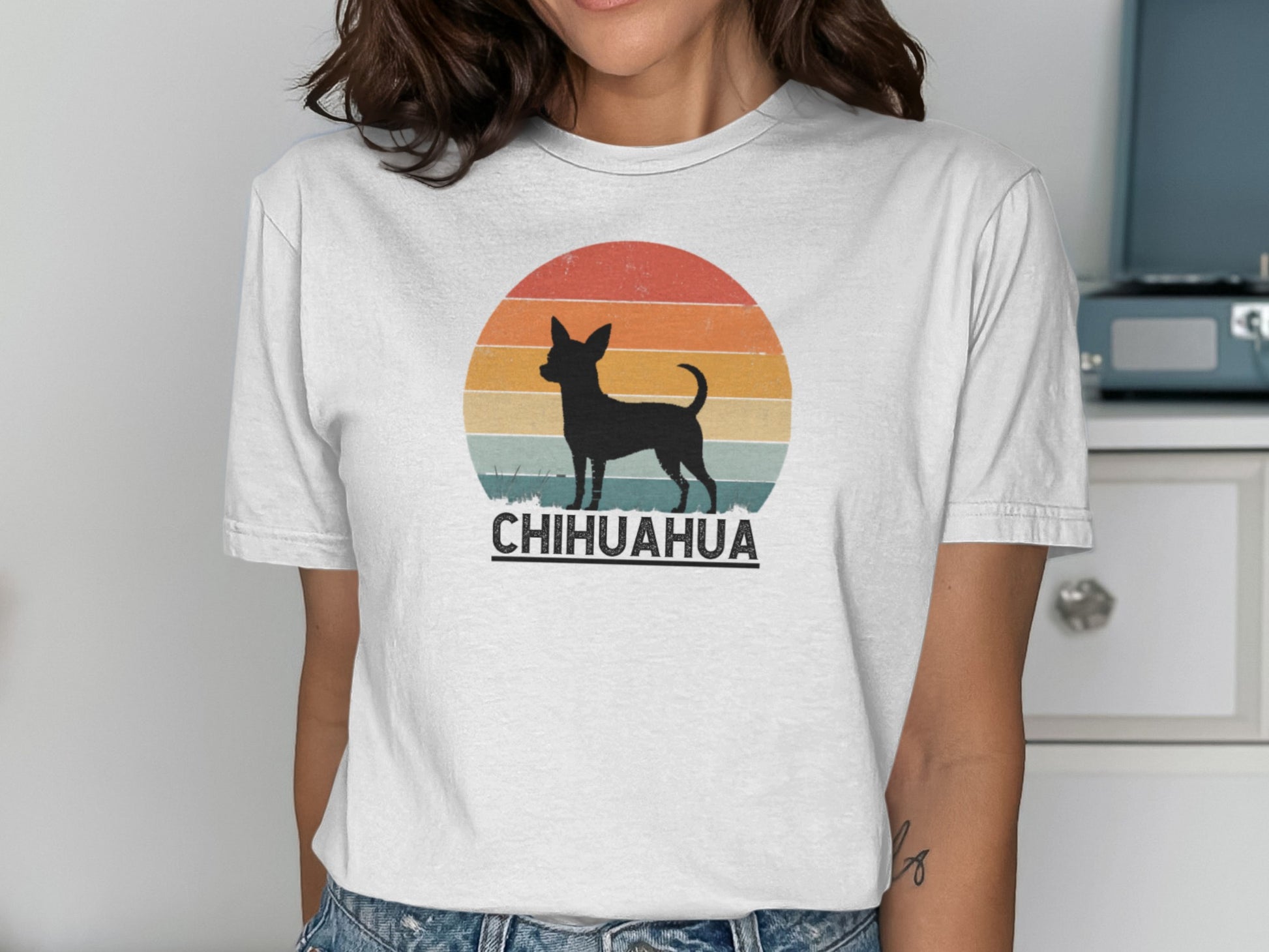 Chihuahua silhouette against a retro sunset on a white t-shirt.