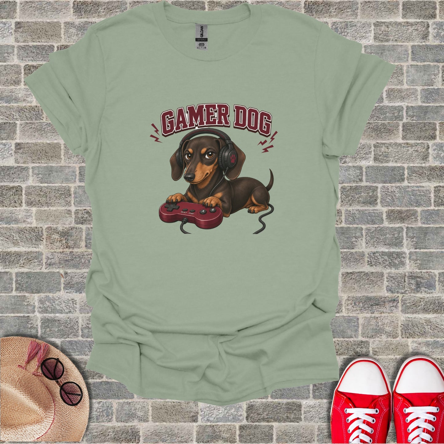 Dog wearing headphones and holding a video game controller.