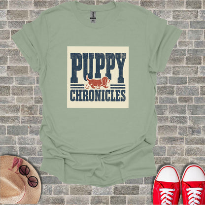 Light green t-shirt with "PUPPY CHRONICLES" text and dog illustration.