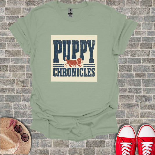 Light green t-shirt with "PUPPY CHRONICLES" text and dog illustration.