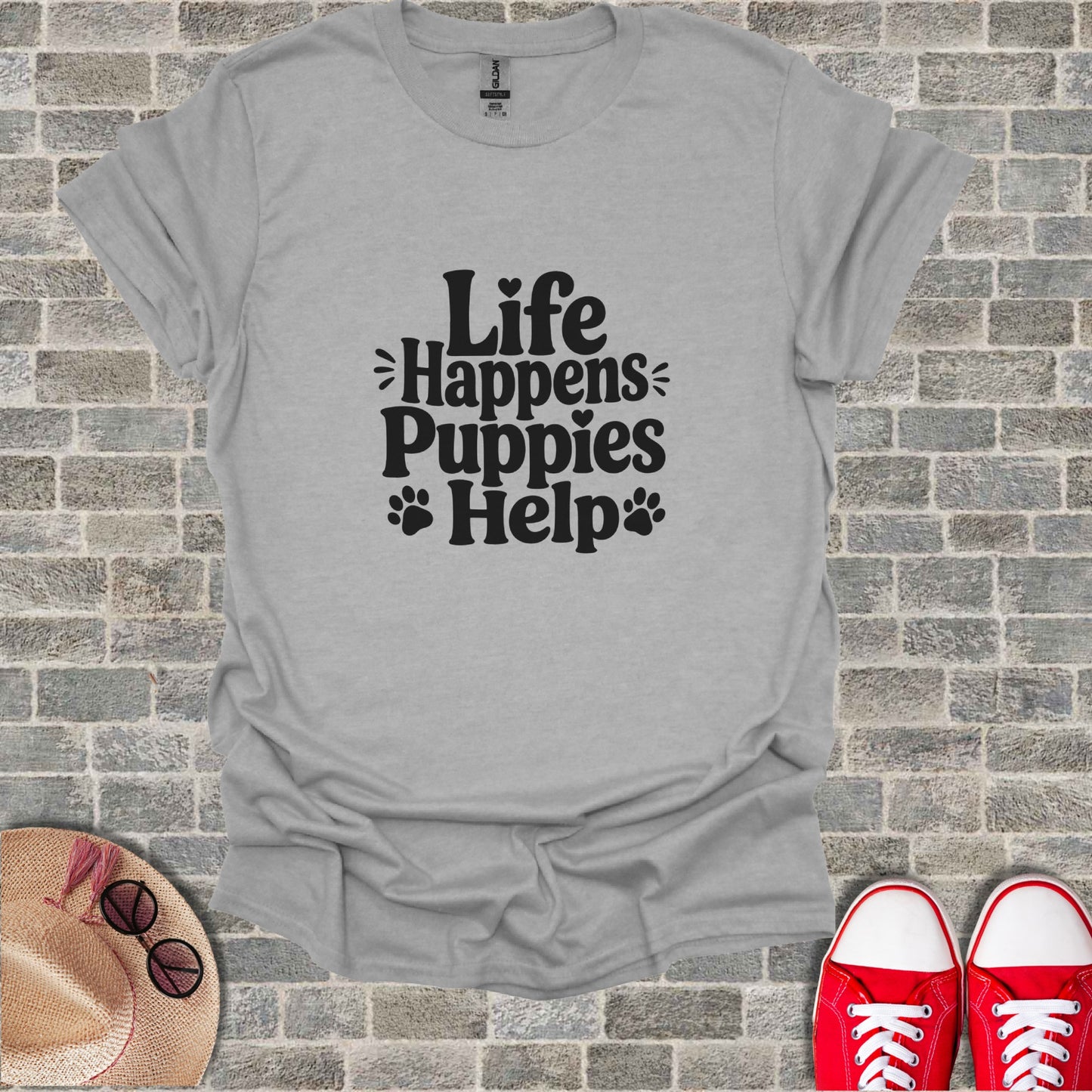 Gray t-shirt with "Life Happens Puppies Help" text and paw prints.