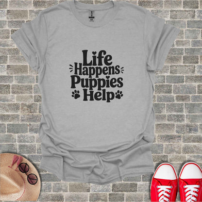 Gray t-shirt with "Life Happens Puppies Help" text and paw prints.