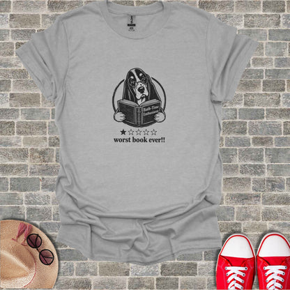 T-shirt with a Bassethound wearing glasses reading a book.