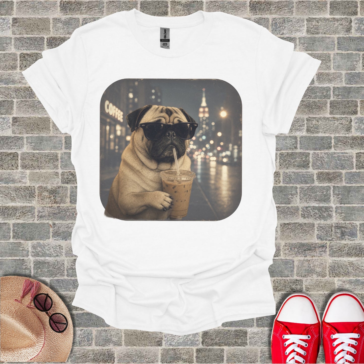 Pug wearing sunglasses drinks iced coffee in front of a city skyline.
