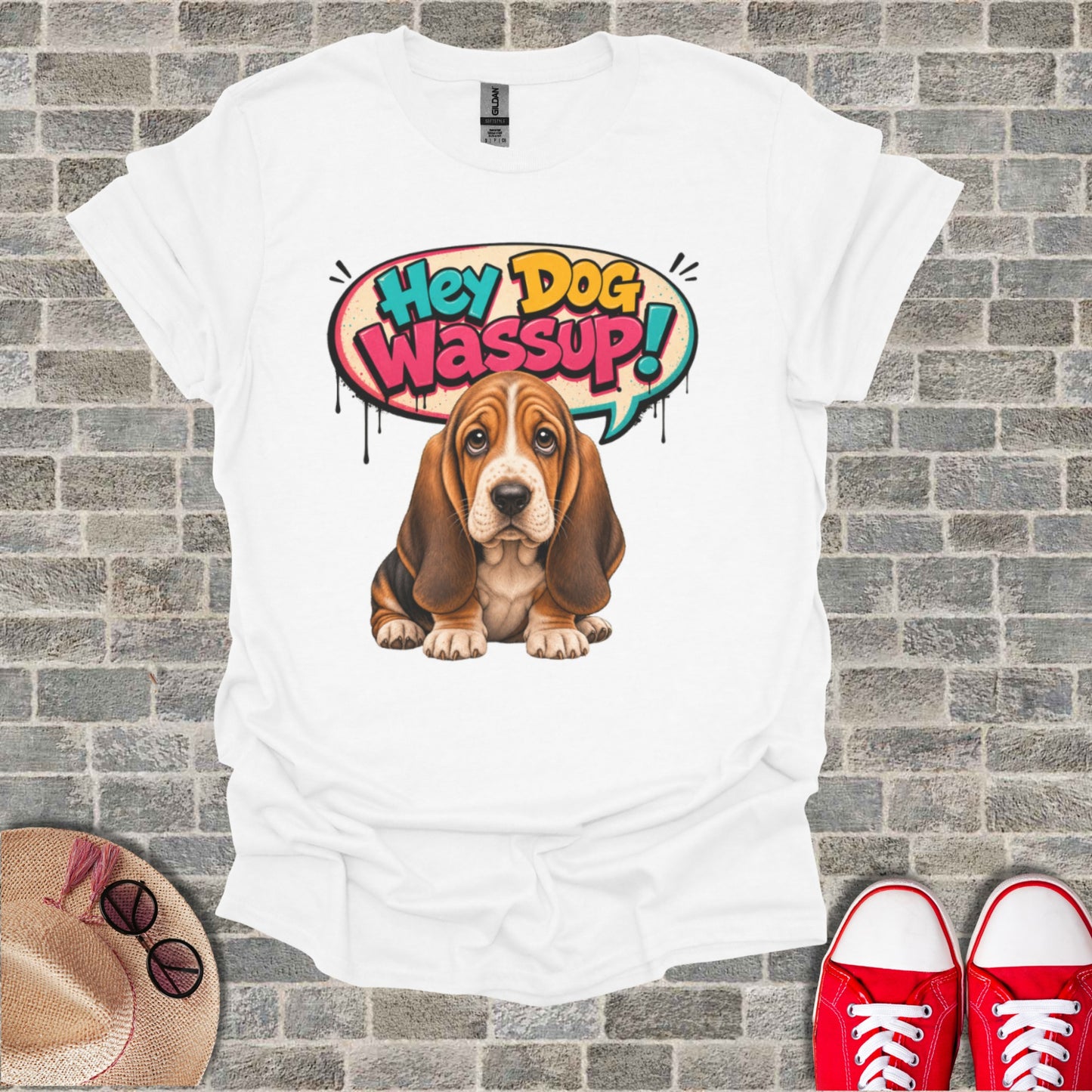 White t-shirt with a cartoon Basset Hound saying "Hey Dog Wassup!".
