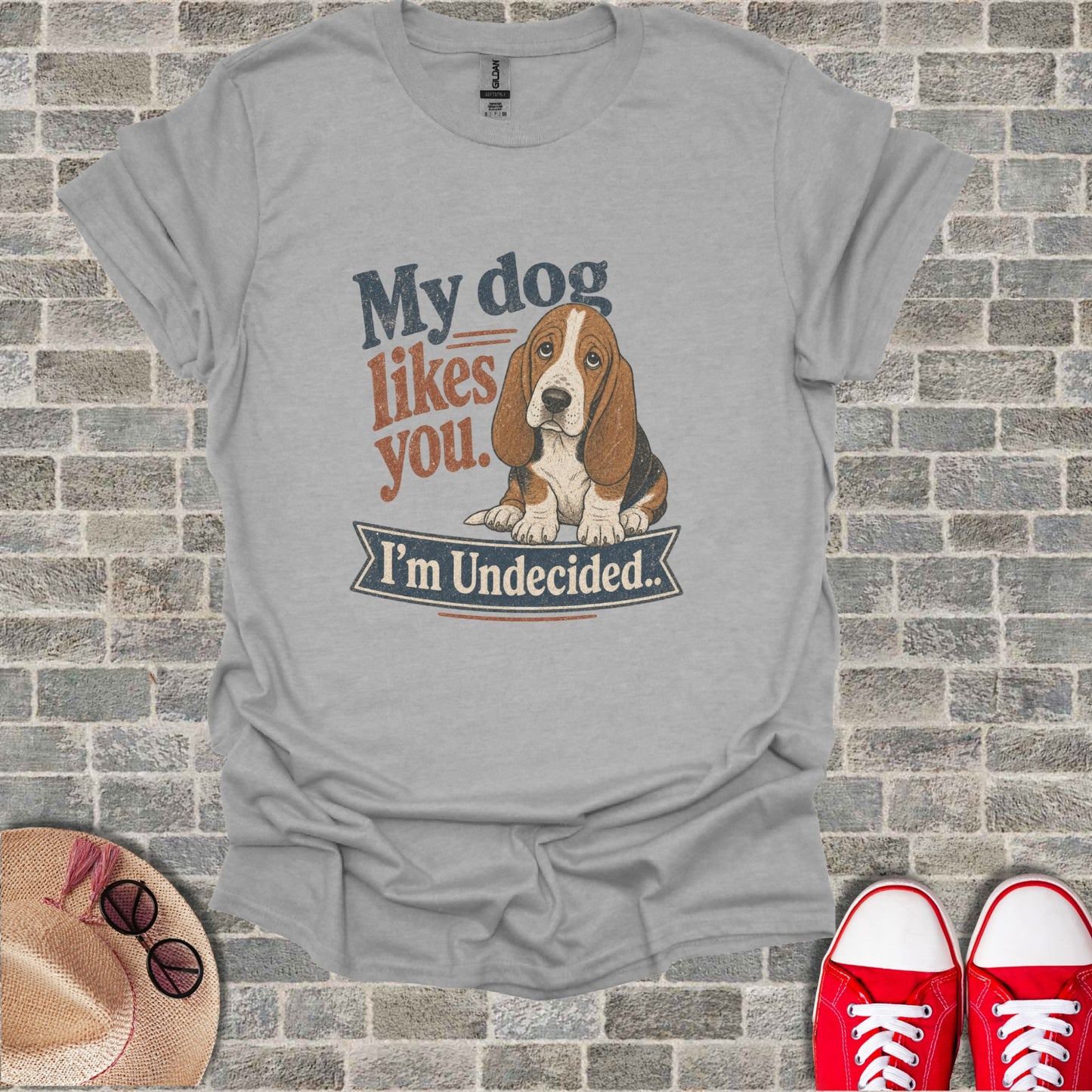 T-shirt with basset hound illustration and text "My dog likes you. I'm Undecided."