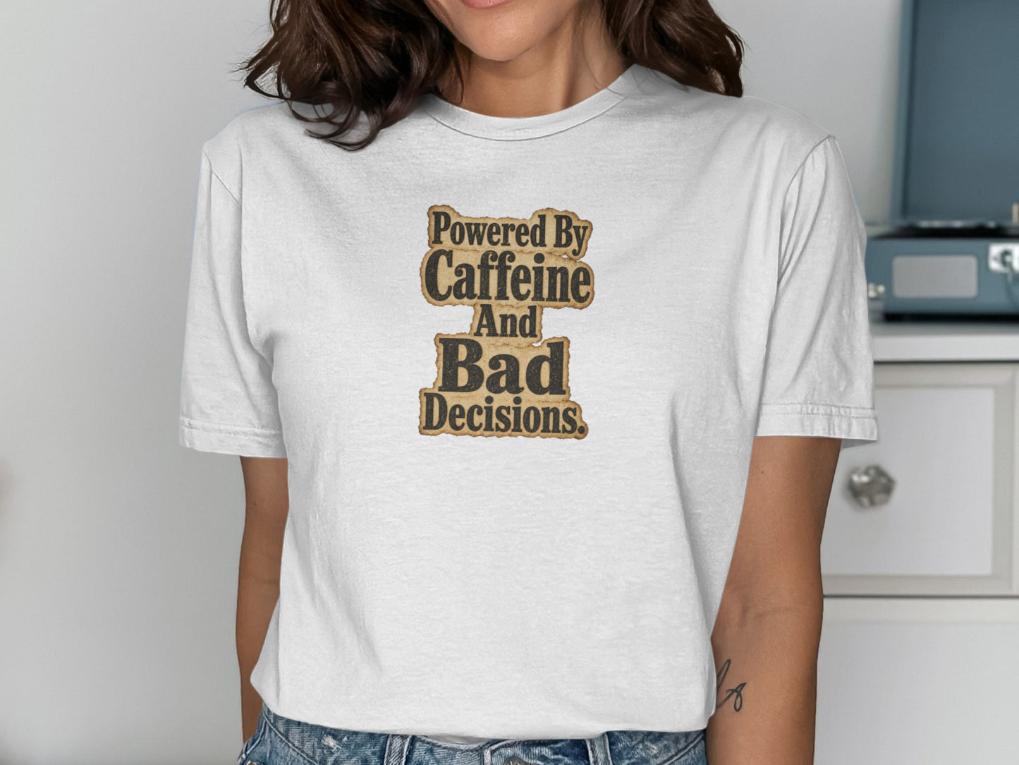 White t-shirt with "Powered By Caffeine And Bad Decisions" text.
