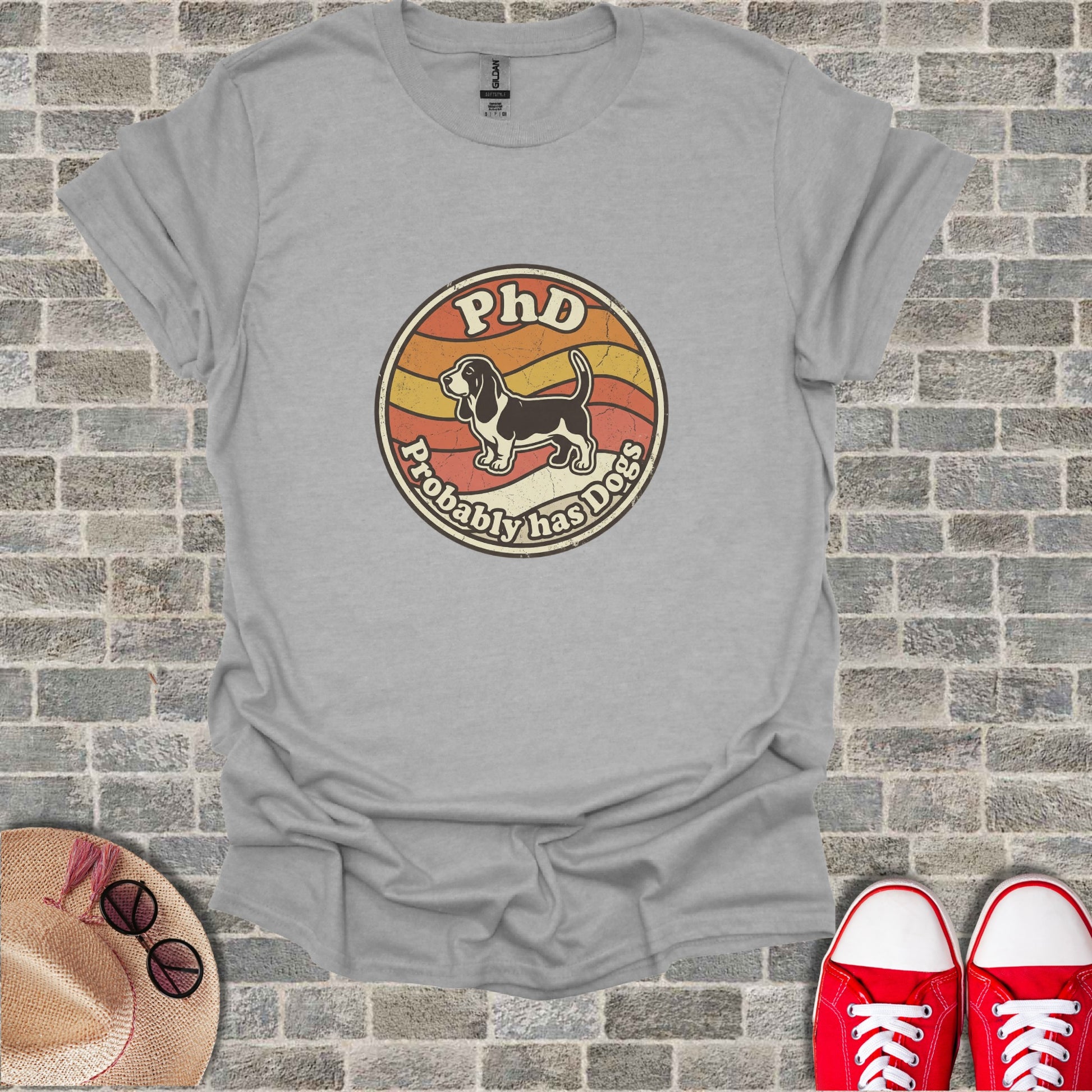 Grey t-shirt with "PhD Probably Has Dogs" distressed text and graphic.
