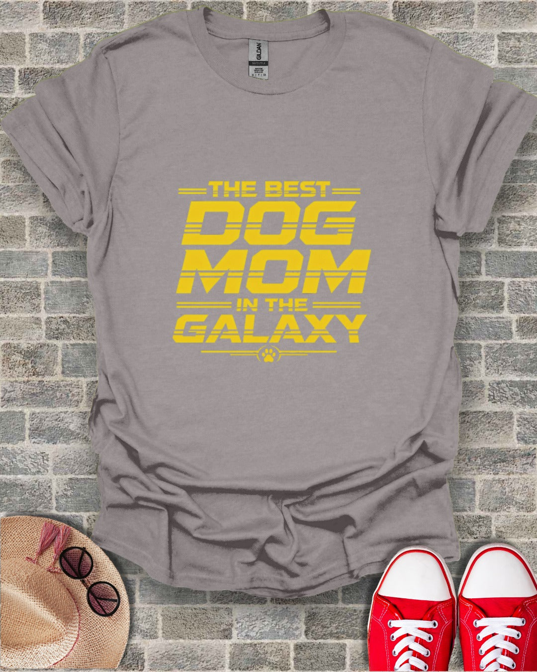 Gray t-shirt with yellow text "THE BEST DOG MOM IN THE GALAXY" and a paw print.