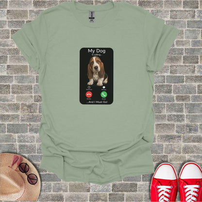 T-shirt with a phone screen design: "My Dog is calling... And I Must Go!"
