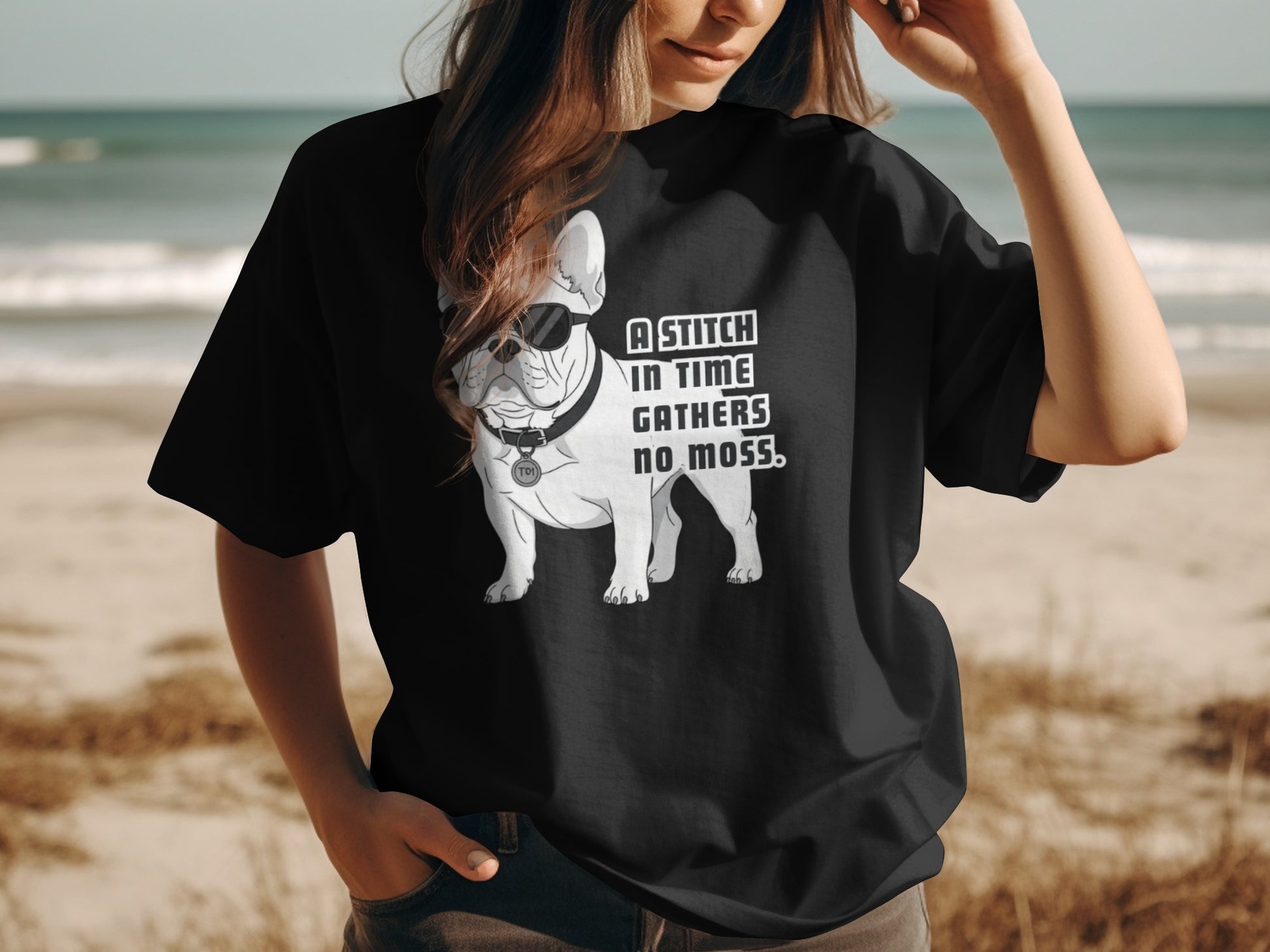 Black t-shirt with French bulldog wearing sunglasses and text "A stitch in time gathers no moss."