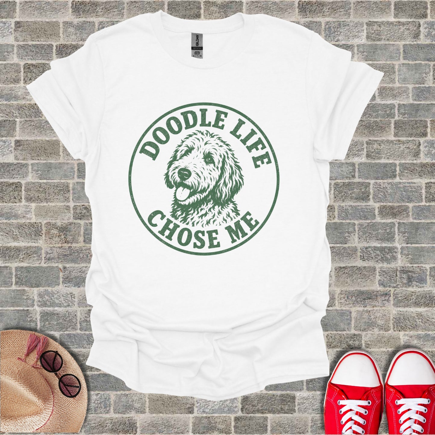 White t-shirt with green circular graphic of a doodle dog and text reading "Doodle Life Chose Me".