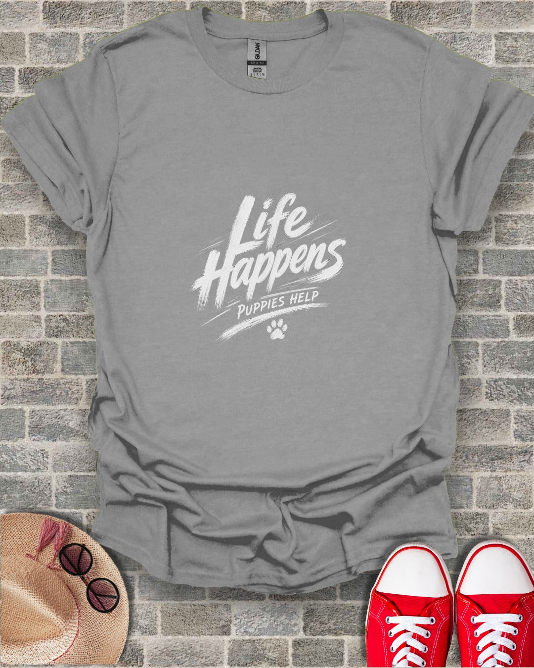 Grey t-shirt with white text "Life Happens Puppies Help" and paw print.