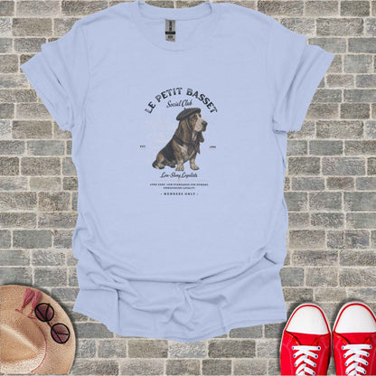 Light blue t-shirt with "Le Petit Basset Social Club" logo.