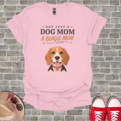 Pink t-shirt with text "Not Just A Dog Mom A Beagle Mom" and a beagle illustration.