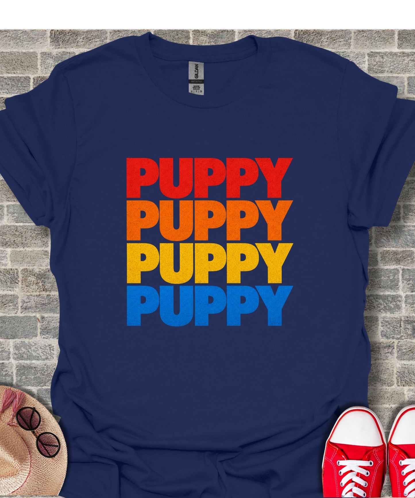Navy t-shirt with stacked "PUPPY" text in red, orange, yellow, and blue.