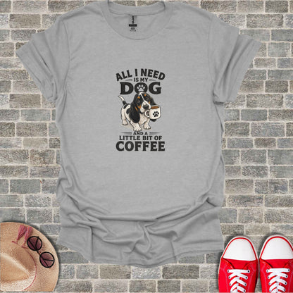 T-shirt with a Basset Hound holding a coffee cup and text "All I Need Is My Dog And A Little Bit Of Coffee".