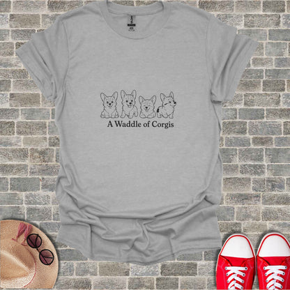 Grey t-shirt with a minimalist line drawing of five corgis and the text "A Waddle of Corgis".
