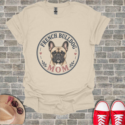 French Bulldog Mom graphic on a cream t-shirt with a straw hat and red shoes.