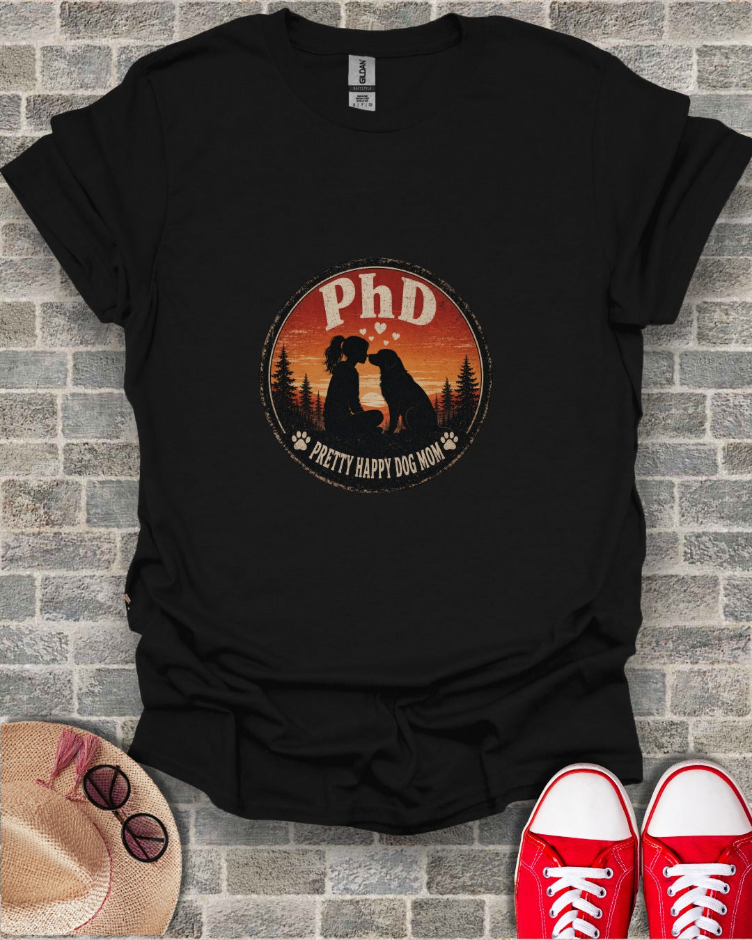 Black t-shirt with "PhD Pretty Happy Dog Mom" text and silhouette of a woman and dog.