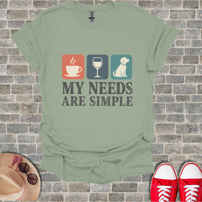 Green t-shirt with a coffee cup, wine glass, and dog graphic and text.
