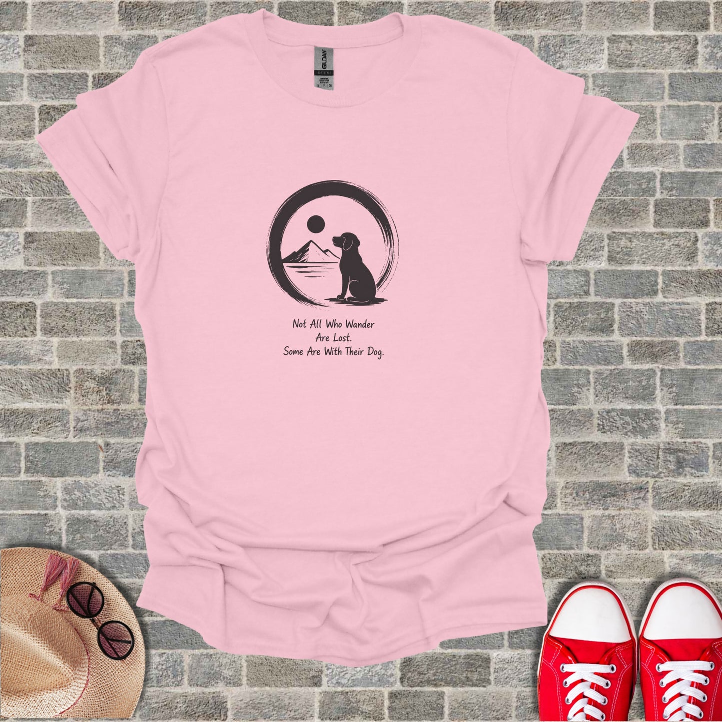 Pink t-shirt with quote and dog silhouette in a circle.