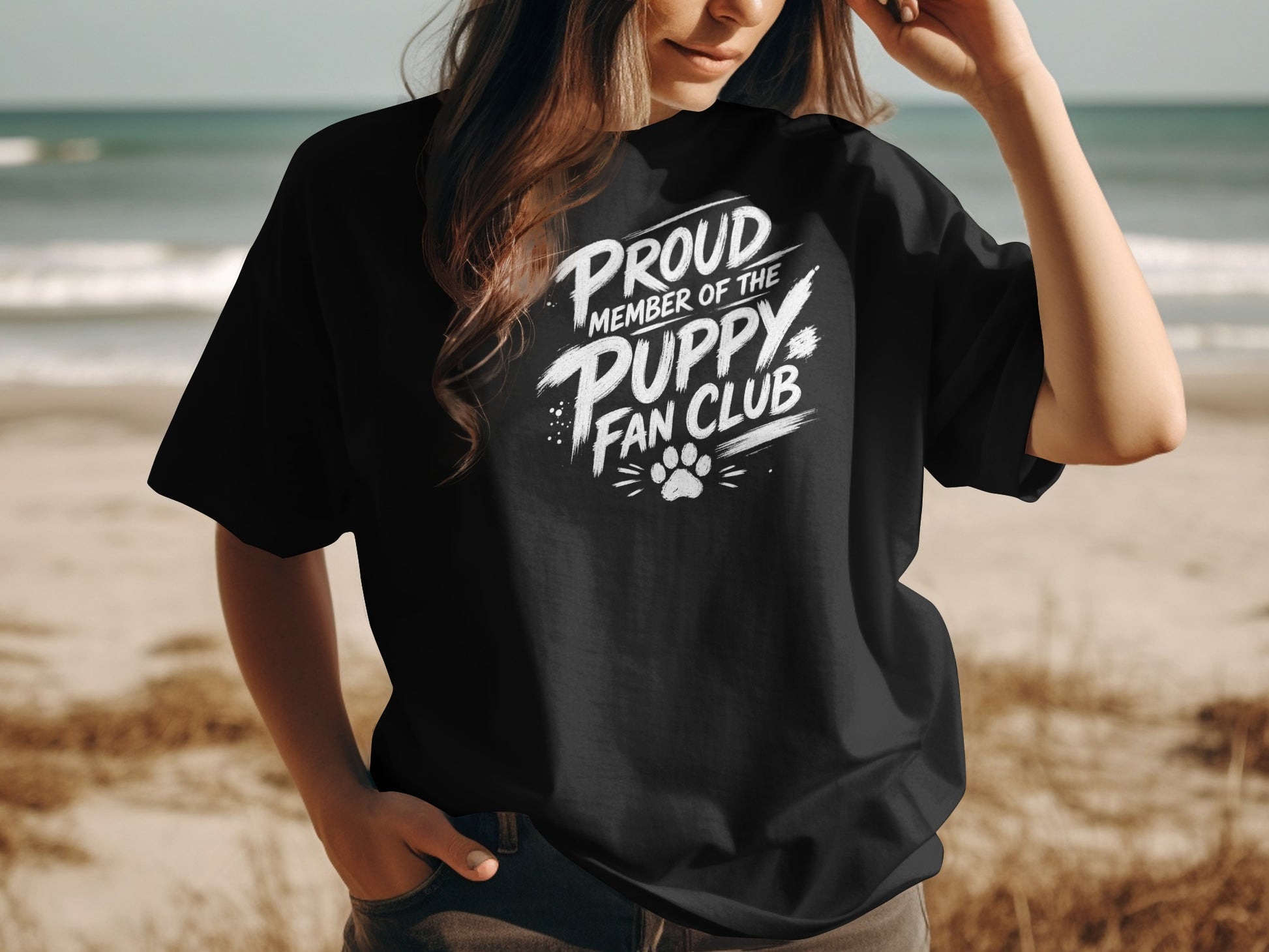 Black t-shirt with white text "Proud Member of the Puppy Fan Club" and paw print.