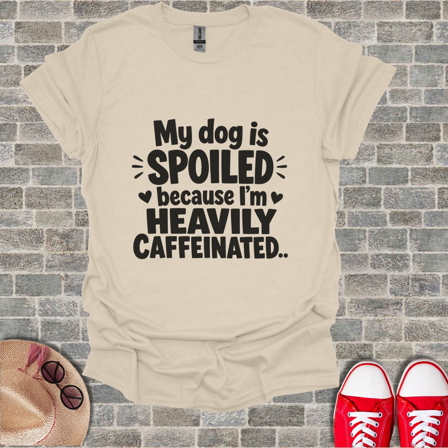 Cream t-shirt with "My dog is spoiled because I'm heavily caffeinated" text.