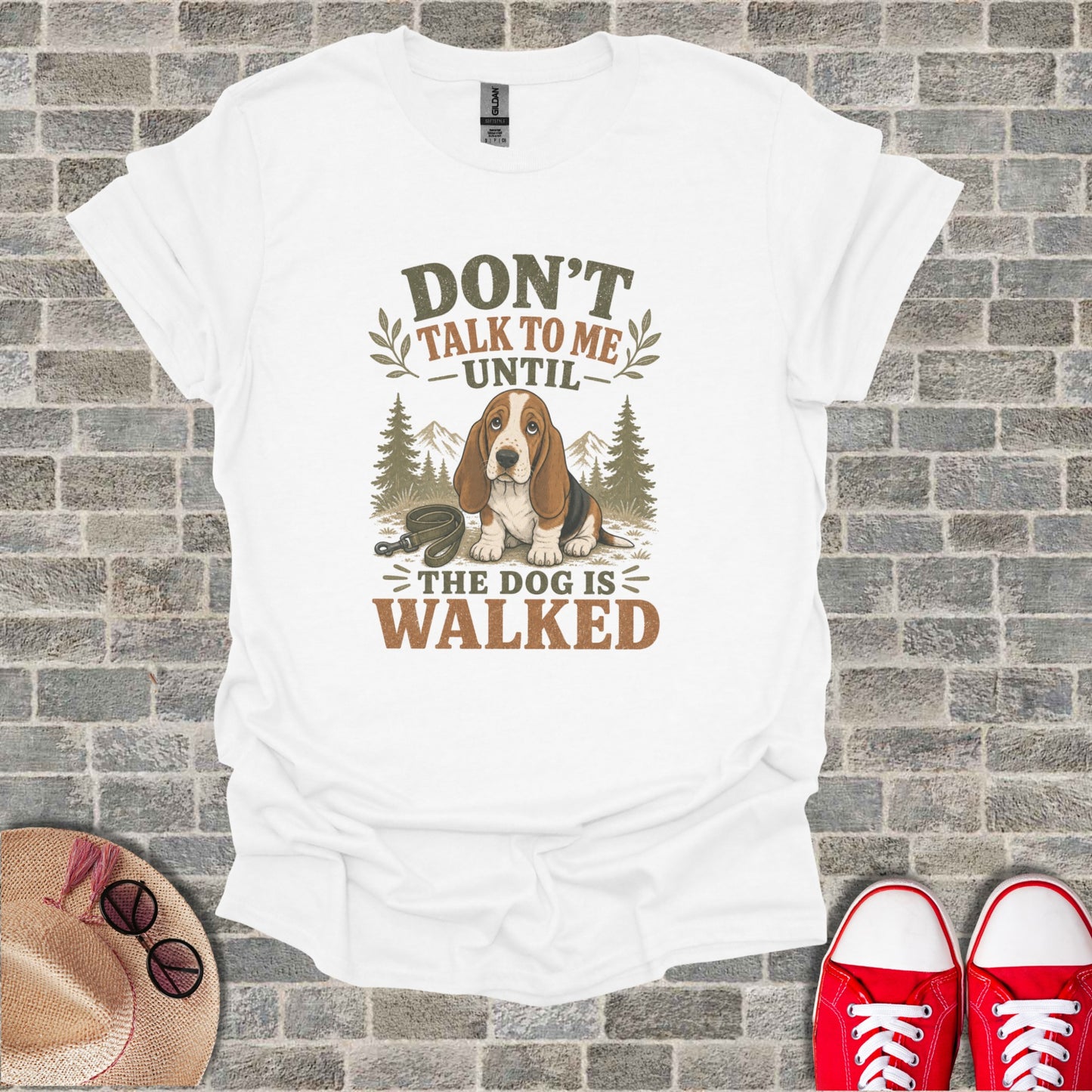 White t-shirt with "Don't talk to me until the dog is walked" text and dog graphic.