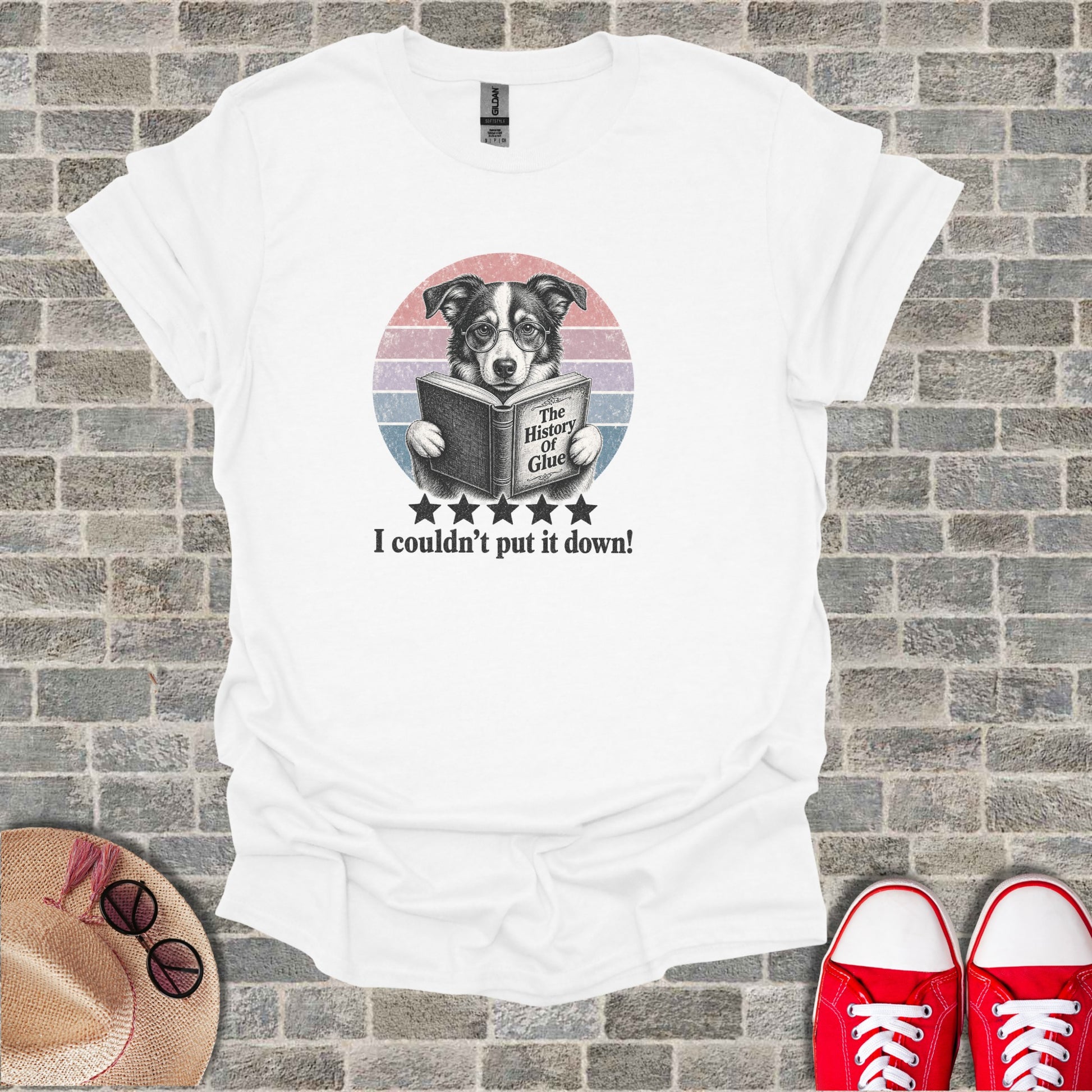 Dog wearing glasses reads "The History of Glue" on a t-shirt.