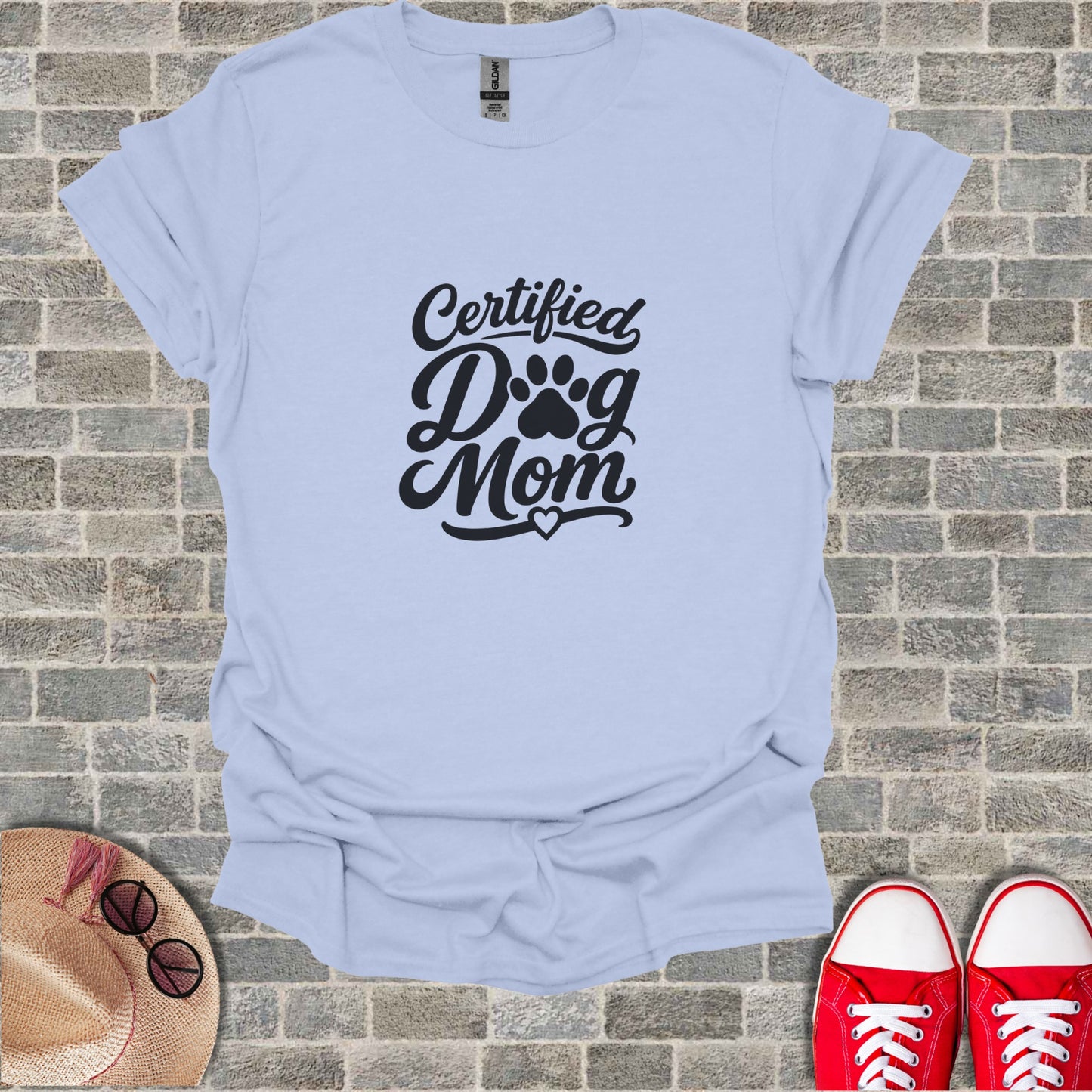 Light blue t-shirt with "Certified Dog Mom" text and paw print design.