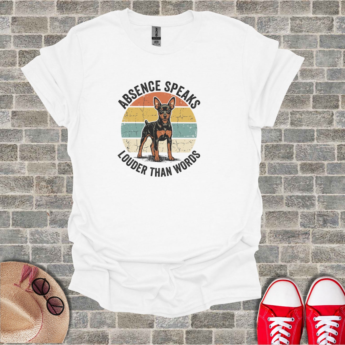 White t-shirt with vintage graphic of a dog and text "Absence Speaks Louder Than Words".