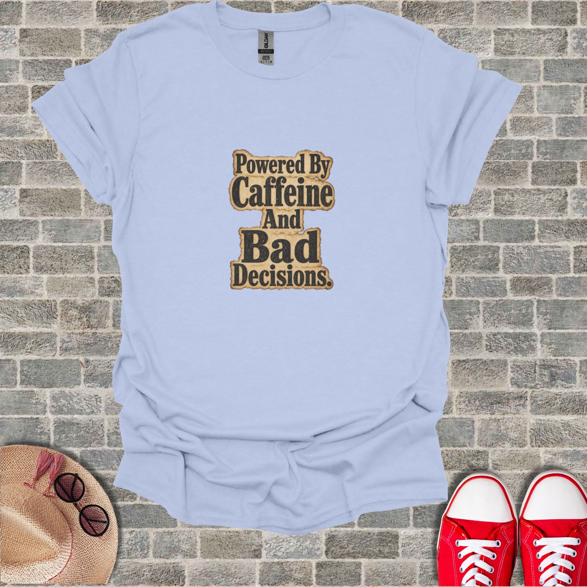 Light blue t-shirt with "Powered By Caffeine And Bad Decisions" text design.