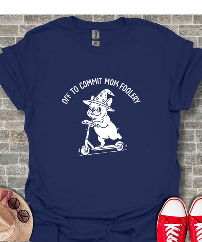 White dog wearing a wizard hat rides a scooter with text "OFF TO COMMIT MOM FOOLERY".