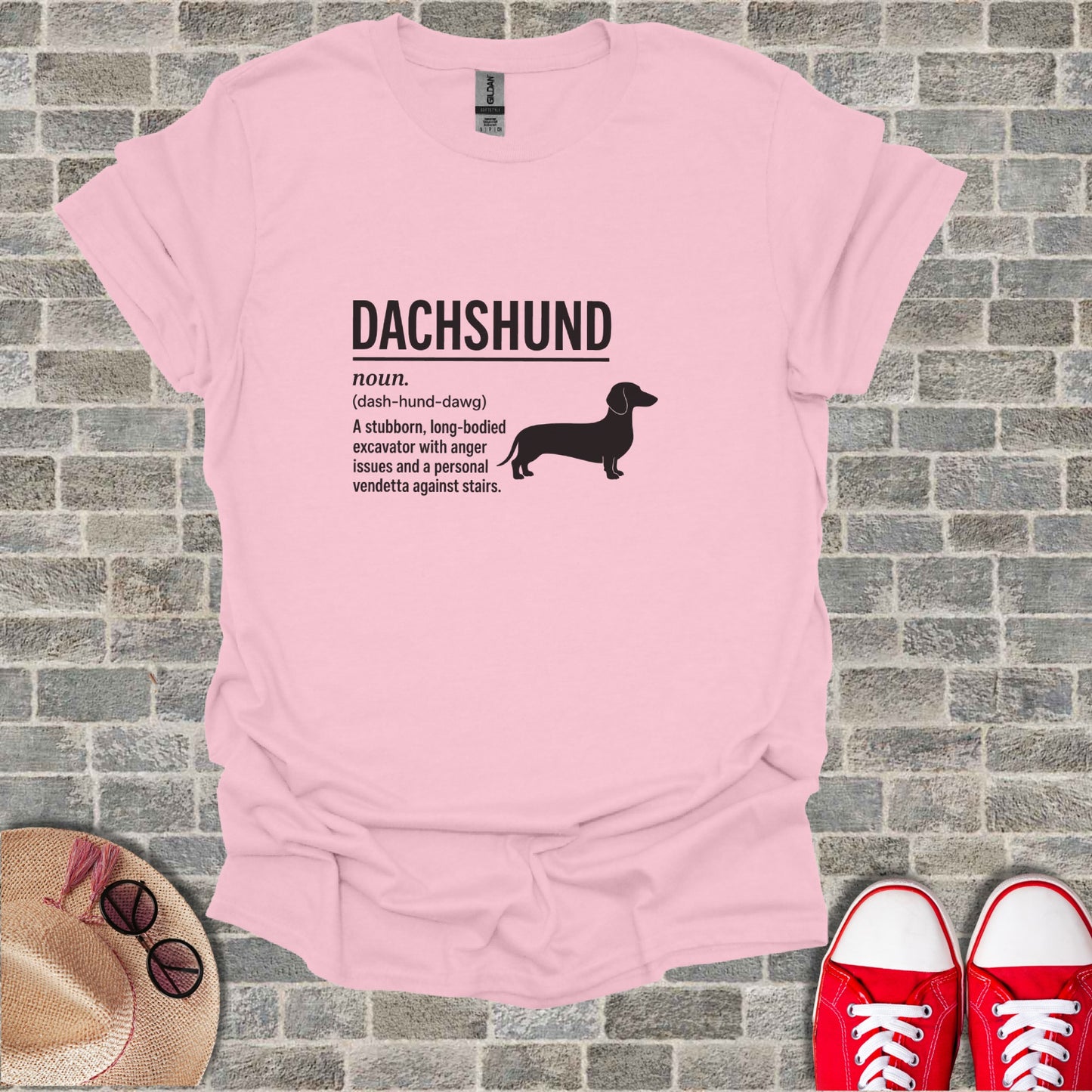 Pink t-shirt with "Dachshund" text and humorous definition.