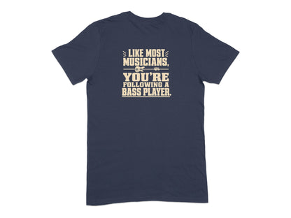 Navy t-shirt with text "Like most musicians, you're following a bass player."