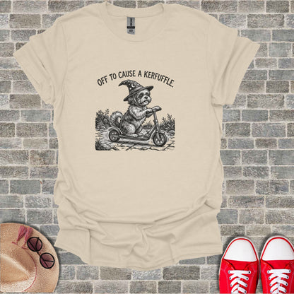 Dog in witch hat riding a scooter with text "Off to Cause a Kerfuffle."
